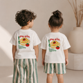 Two children wearing matching t-shirts with pasta design and 'buon appetito' text.
